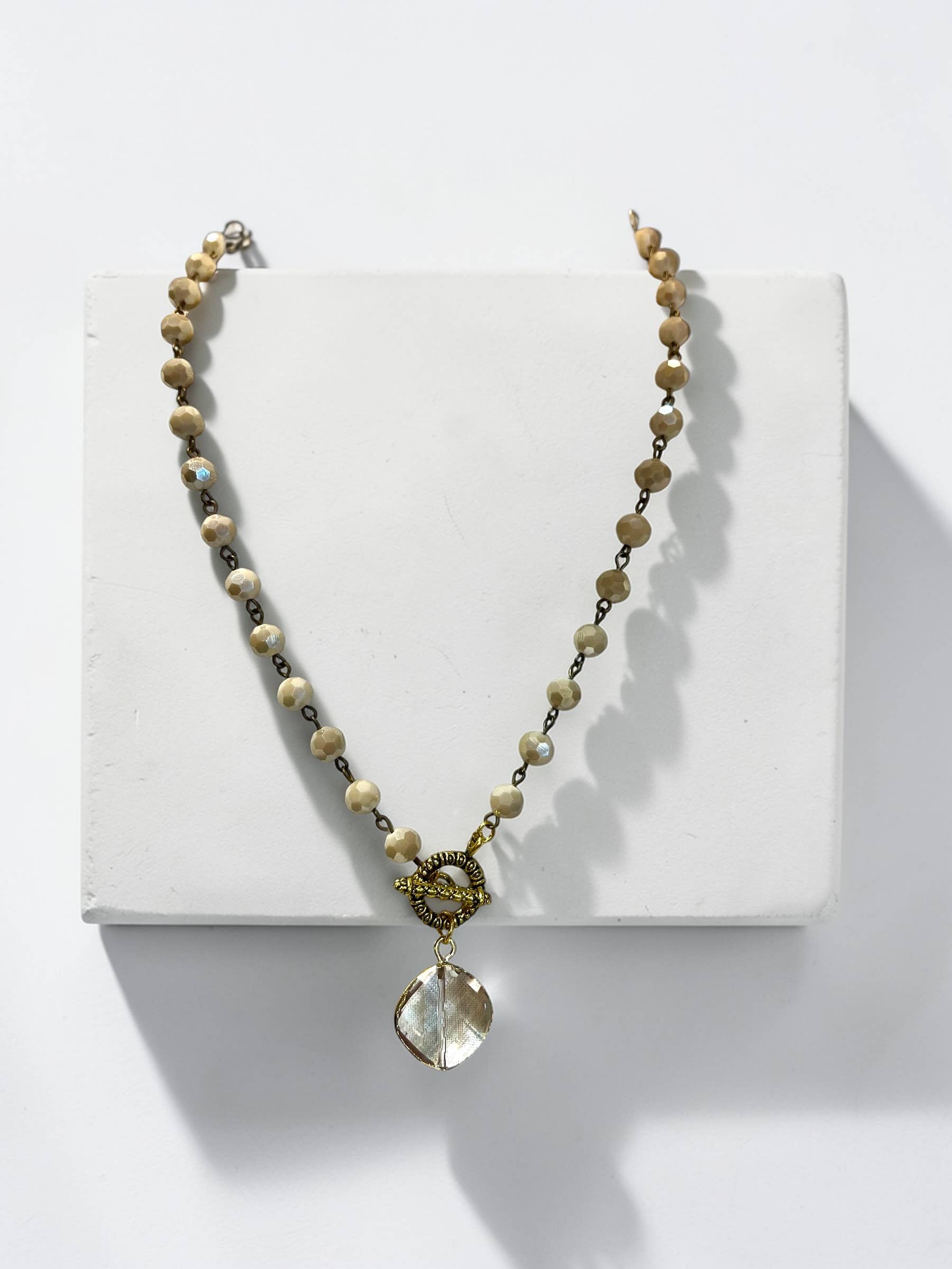 Ava Capri Necklace Jenna toggled 20" ivory Necklace with faceted pendant