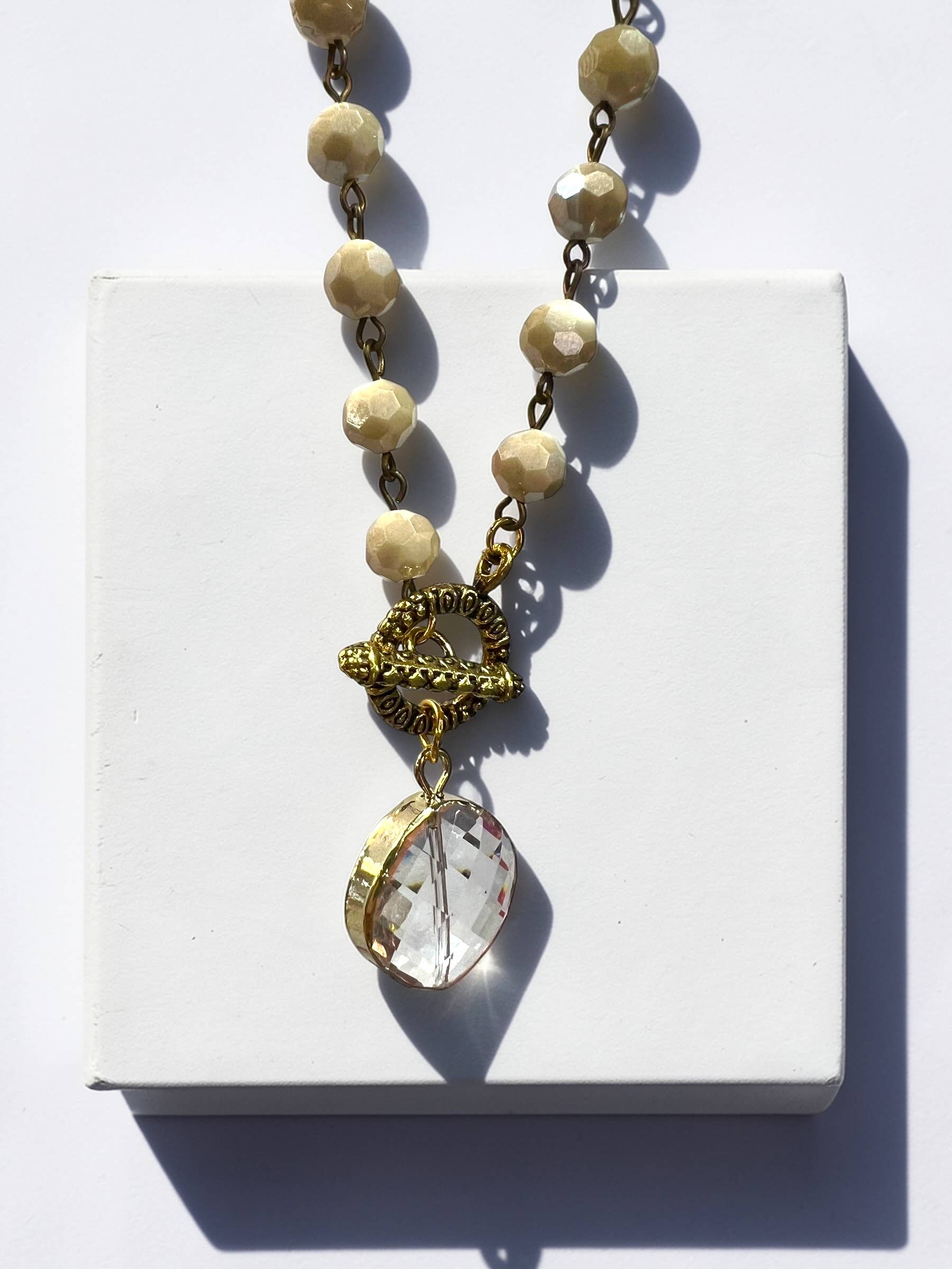 Ava Capri Necklace Jenna toggled 20" ivory Necklace with faceted pendant